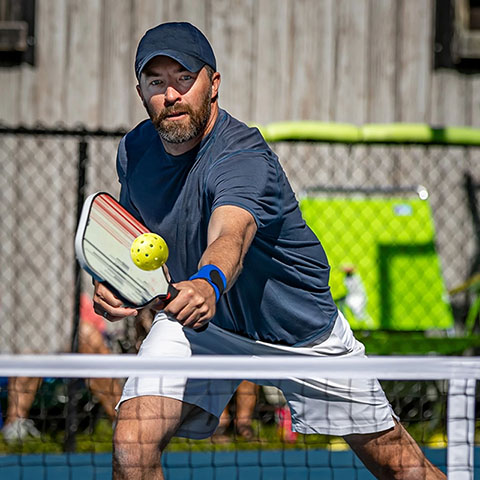 Image of another white man playing pickleball